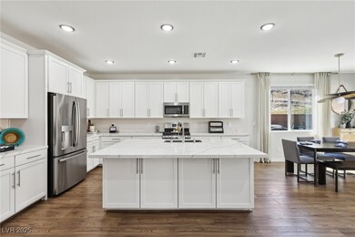 Kitchen featuring stainless steel appliances, whit