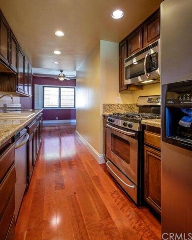 Elegant kitchen with stainless steel appliances, g