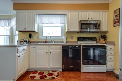 The kitchen opens to the den and also has a pantry and eat-in area.