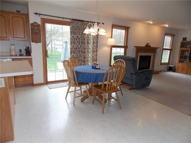 Eat-in kitchen leads through sliding glass door to