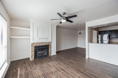 Unfurnished living room with dark hardwood / wood-