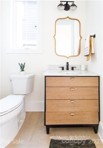 Downstairs Powder room just off the entry way.  This oak and white marble vanity presents a modern/contemporary style .