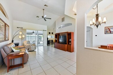 Spacious, open living room. Formal dining room to the right. Large sliders open out to the pool and large entertaining lanai.