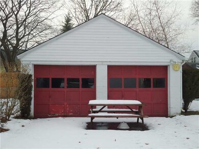 Exterior Front. VERY ROOMY TWO CARE GARAGE WITH DO