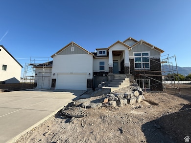 Craftsman-style home featuring board and batten siding, concrete driveway, an attached garage, stairs, and stone siding