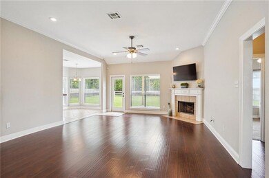 Large living room with 10' ceilings, fireplace ope