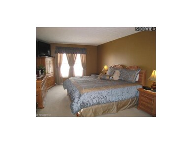 Relaxing master suite with walk-in closet.