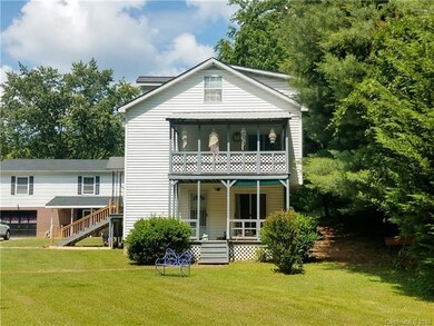 Side of Large White House 5BR/3BA