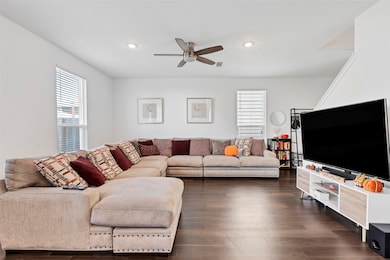 The living room has an abundance of natural light