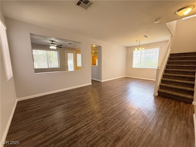 Unfurnished living room featuring dark wood-style