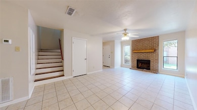 Unfurnished living room with ceiling fan, light ti
