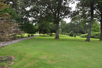 This home is nestled among the towering shade tree