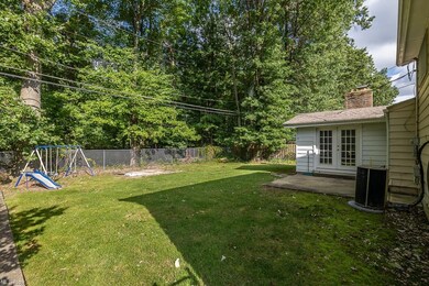 View of yard with a patio, french doors, and a pla