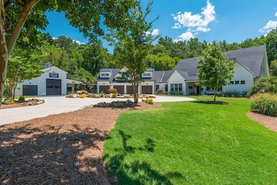 View of 4-car garage and party barn
