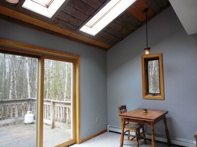 Vaulted ceiling and skylights in dining room