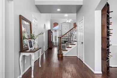 The engineered wood floors are located throughout the entire first floor, except for in the kitchen, laundry room and primary bathroom.  Those rooms have tile flooring.