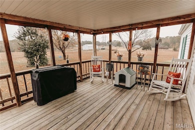 Sunroom / solarium with a deck