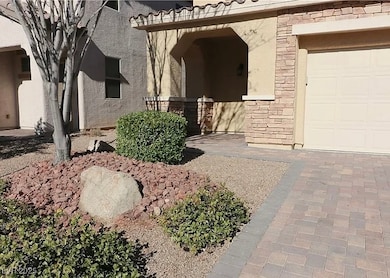 Doorway to property featuring stone siding, stucco