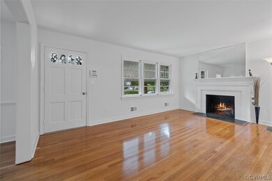 Living room featuring light hardwood  and a fireplace