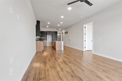 Unfurnished living room featuring recessed lighti