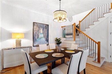 Dining space featuring stairway, light wood finish