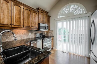 Kitchen features granite countertops, stainless ap