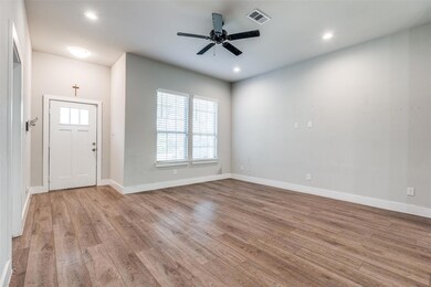 Entrance foyer with ceiling fan and light wood-typ