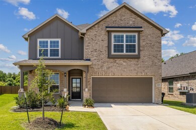 Charming two-story home with a brick exterior, fea