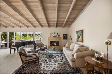 Living room with fireplace and view of the yard.