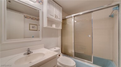 Full bathroom with vanity, bath / shower combo wit