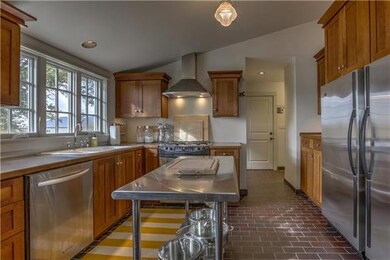 The modernized kitchen features stainless steel ap