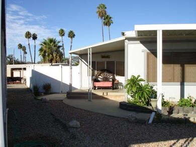 Front entryway with vinyl fencing gate on the left