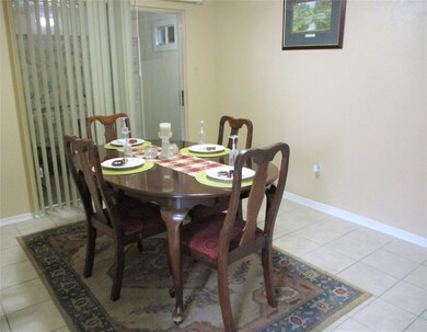 Dining room with accent lighting throughout the home is adjacent to the renovated kitchen and private closed in gym/meditation room or can be used as a bonus space that was originally the patio.
