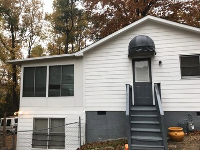 Side Entrance with Added sunroom and basement