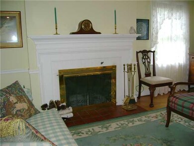 Living Room. The woodburning fireplace adds a warm