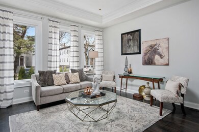Gorgeous living room overlooks the beautifully lan