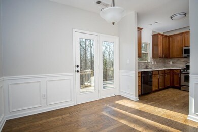 Kitchen with visible vents, dark wood-type floorin
