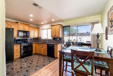 Remodeled kitchen opens up to the dining area with direct access to large outdoor patio.