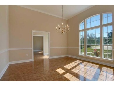 Dining Room. Arched window formalizes this Dining 