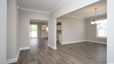 Spare room with an inviting chandelier, a healthy 