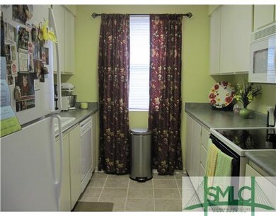 Kitchen. Galley kitchen with lots of cupboards, mi