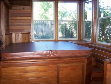 Enclosed sun room with hot tub