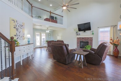 Enter into a large living space with ceilings to t