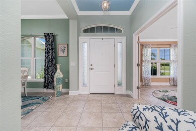 Front enry with tray ceiling and crown molding - dining room to the left and office to the right