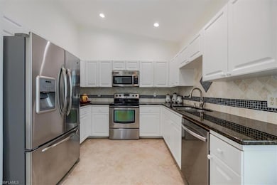 Kitchen with vaulted ceiling, stainless steel appl