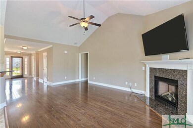Large living room with hardwood floors in the main