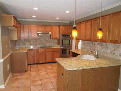 The kitchen boasts lots of granite counter space, 