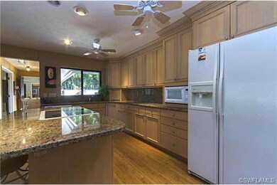 Updated Kitchen With Wood Cabinets, Granite Tops &