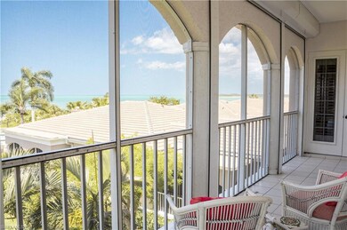 Sunroom / solarium featuring a water view