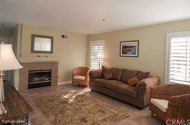 Large family room with fireplace with granite tile